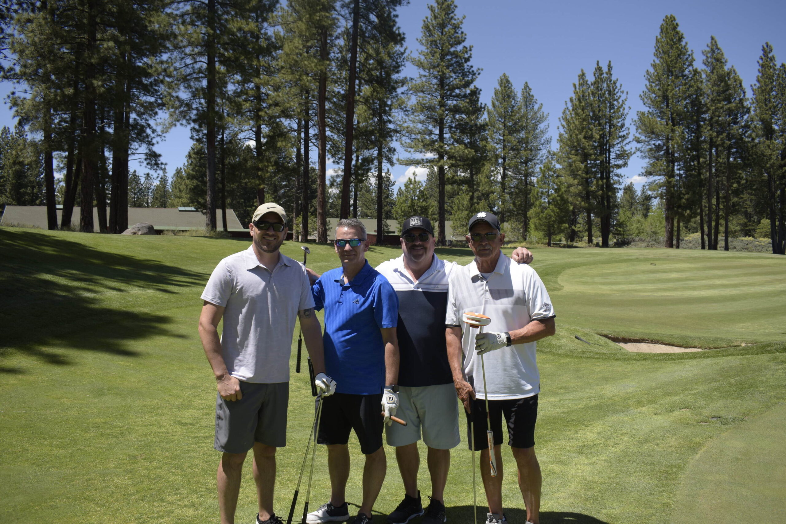Foursome on green at Old Greenwood, NVforHD 2024 annual tournament