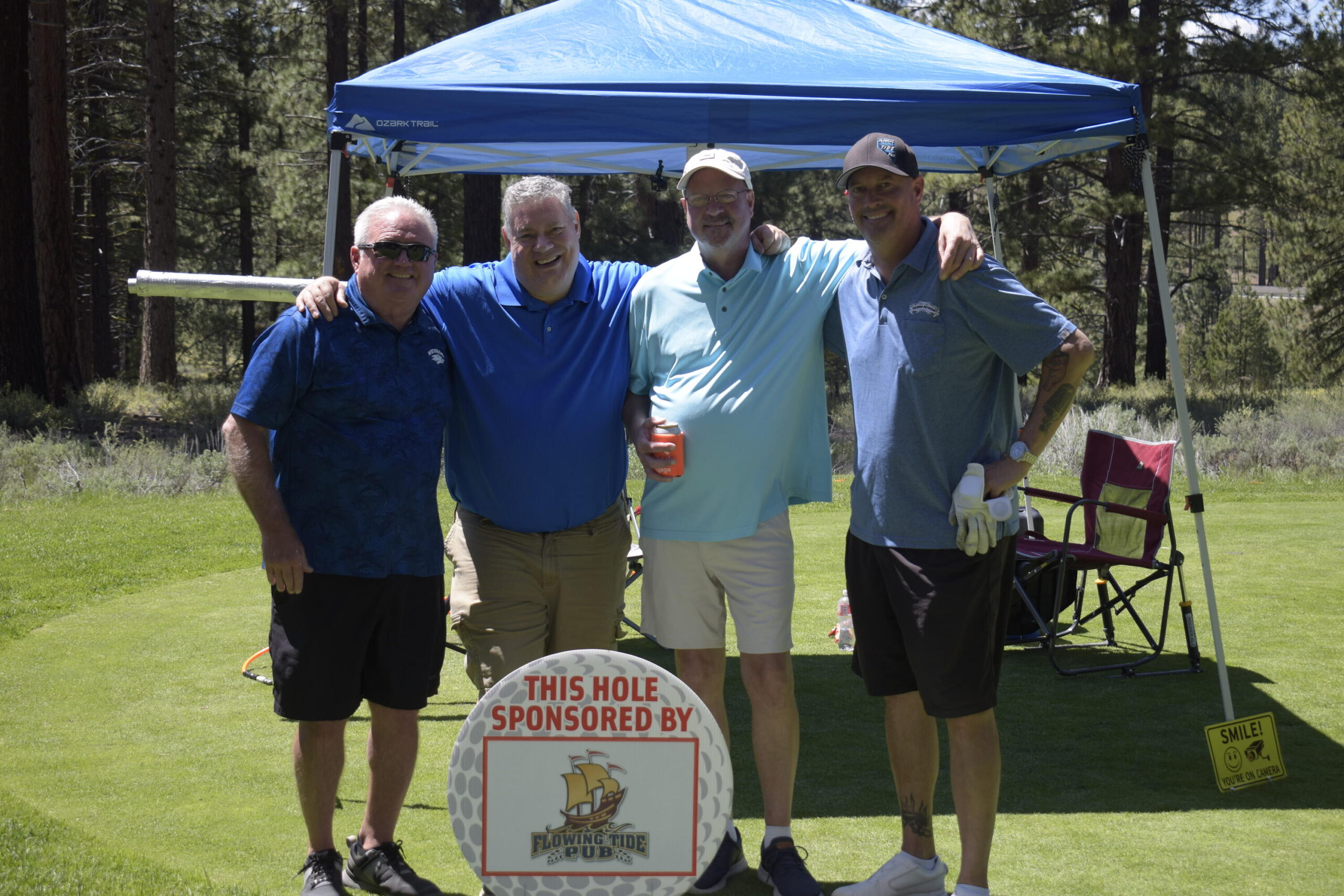 Flowing Tide Pub hole sponsor sign at NVforHD 2024